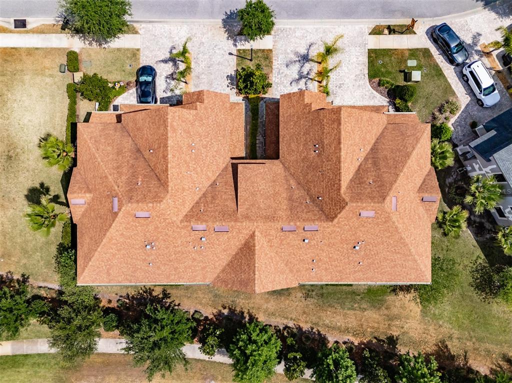 4730 Wandering Way Wesley Chapel, FL 33544 - Photo 46 of 61 an aerial view of a house with a yard