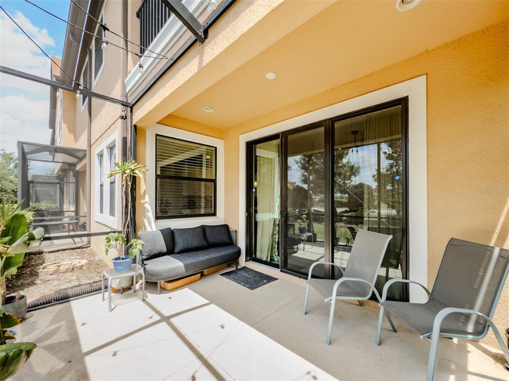 4730 Wandering Way Wesley Chapel, FL 33544 - Photo 47 of 61 a balcony with furniture and a potted plant