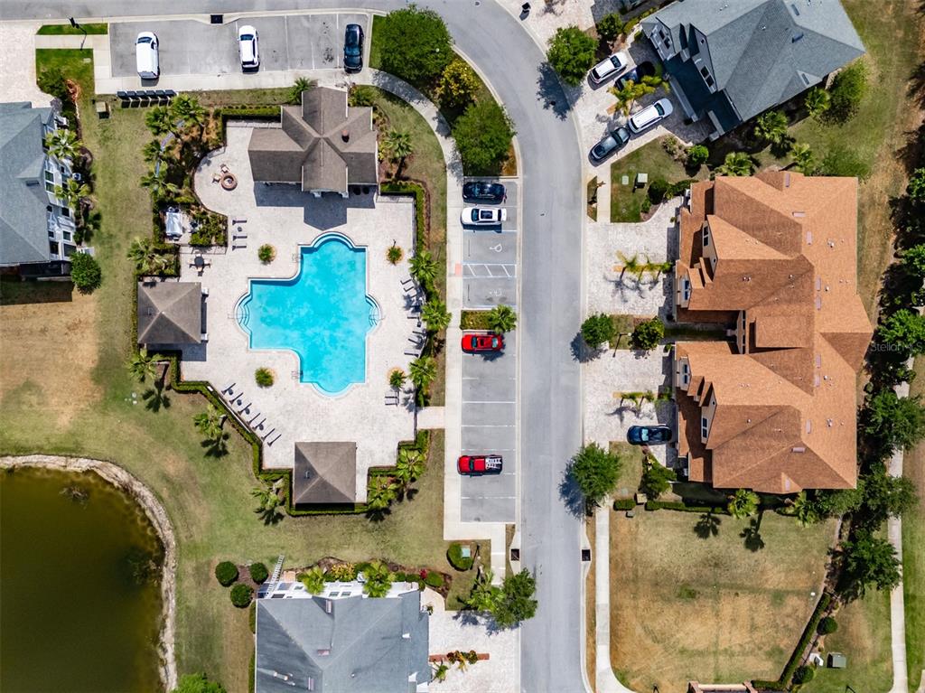 4730 Wandering Way Wesley Chapel, FL 33544 - Photo 61 of 61 an aerial view of residential houses with outdoor space and parking