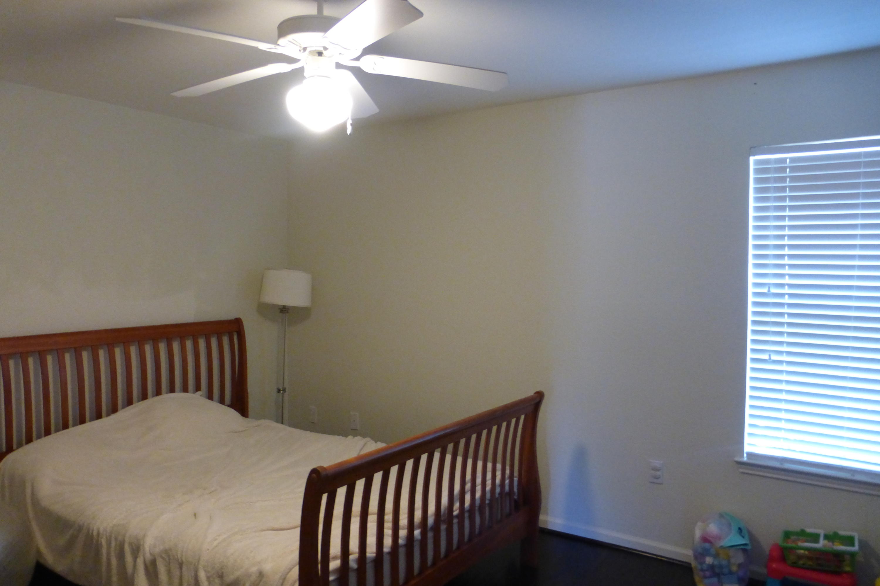1150 Airport Road, Unit 110 Destin, FL 32541 - Photo 3 of 4 a bedroom with a bed and a window