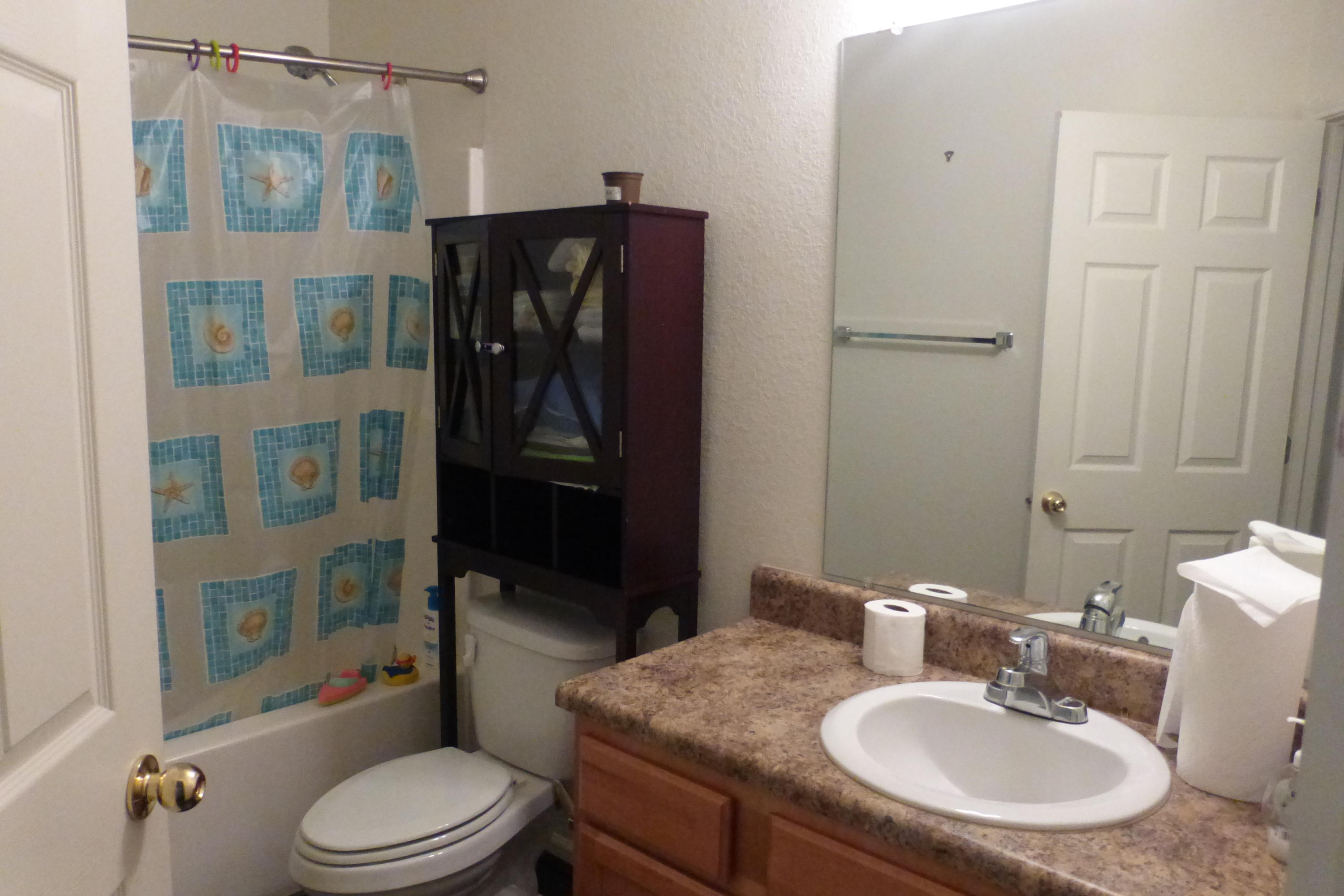 1150 Airport Road, Unit 110 Destin, FL 32541 - Photo 4 of 4 a bathroom with a sink toilet and shower