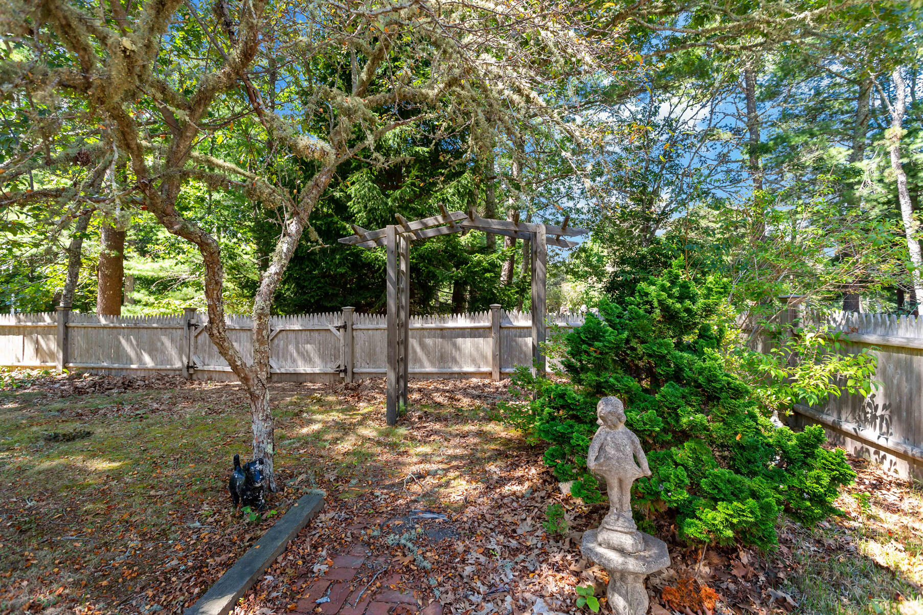 426 Old Post Road Cotuit, MA 02635 - Photo 17 of 27 a view of a yard with plants and trees