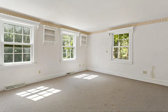 an empty room with windows