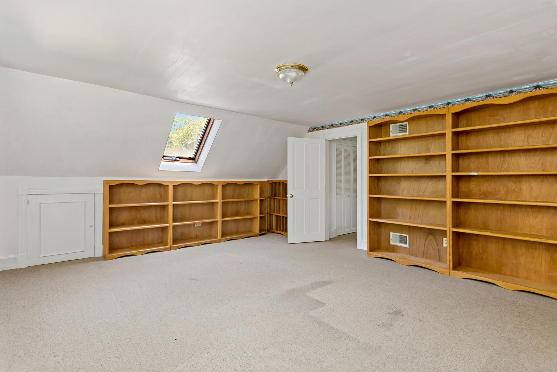 426 Old Post Road Cotuit, MA 02635 - Photo 10 of 27 a view of an empty room with a fireplace and a window