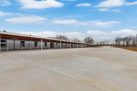 a view of house with outdoor space and seating