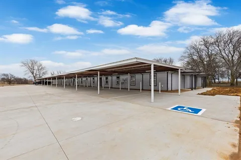a view of a house with basketball court