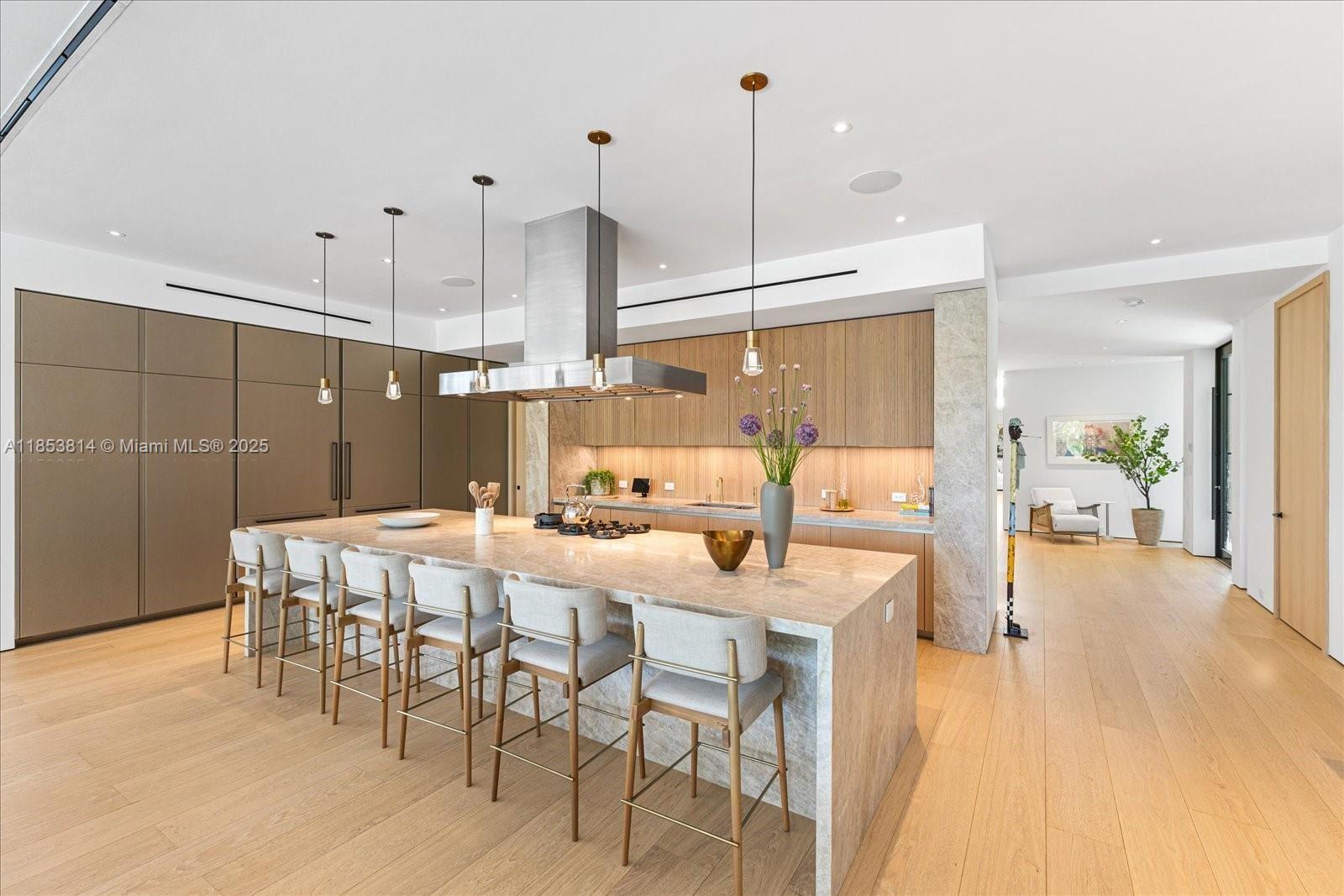1510 West 23rd Street Miami Beach, FL 33140 - Photo 3 of 11 a dining room filled with furniture and wooden floor