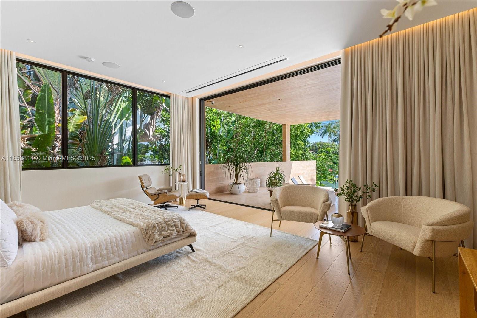 1510 West 23rd Street Miami Beach, FL 33140 - Photo 7 of 11 a bedroom with a bed and a large window