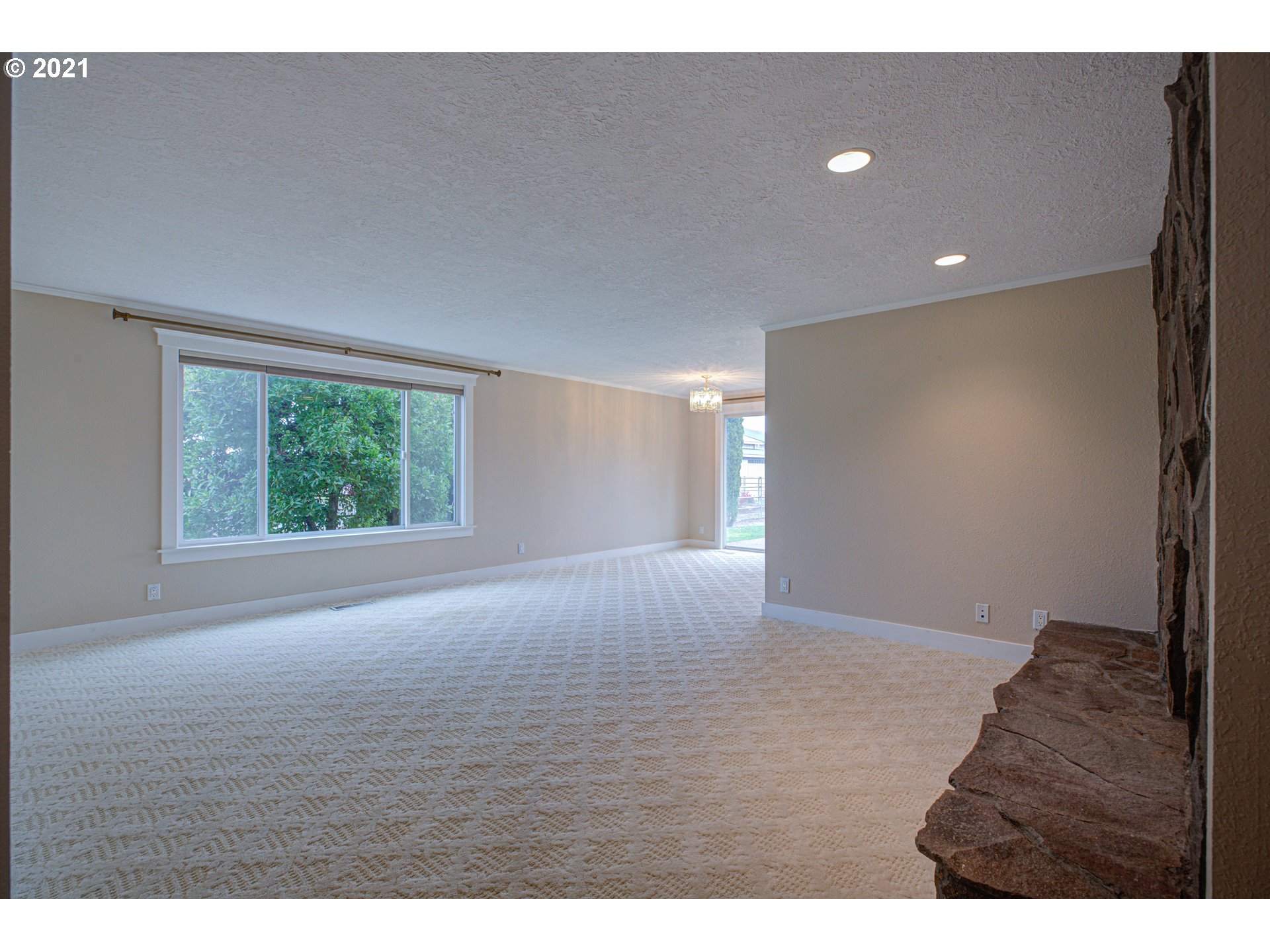 22900 South Haines Road Canby, OR 97013 - Photo 14 of 31 a view of an empty room with wooden floor and a window