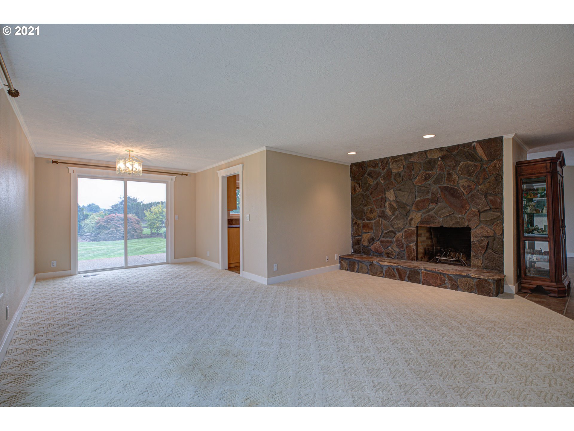 22900 South Haines Road Canby, OR 97013 - Photo 17 of 31 a view of an empty room with a fireplace and a window