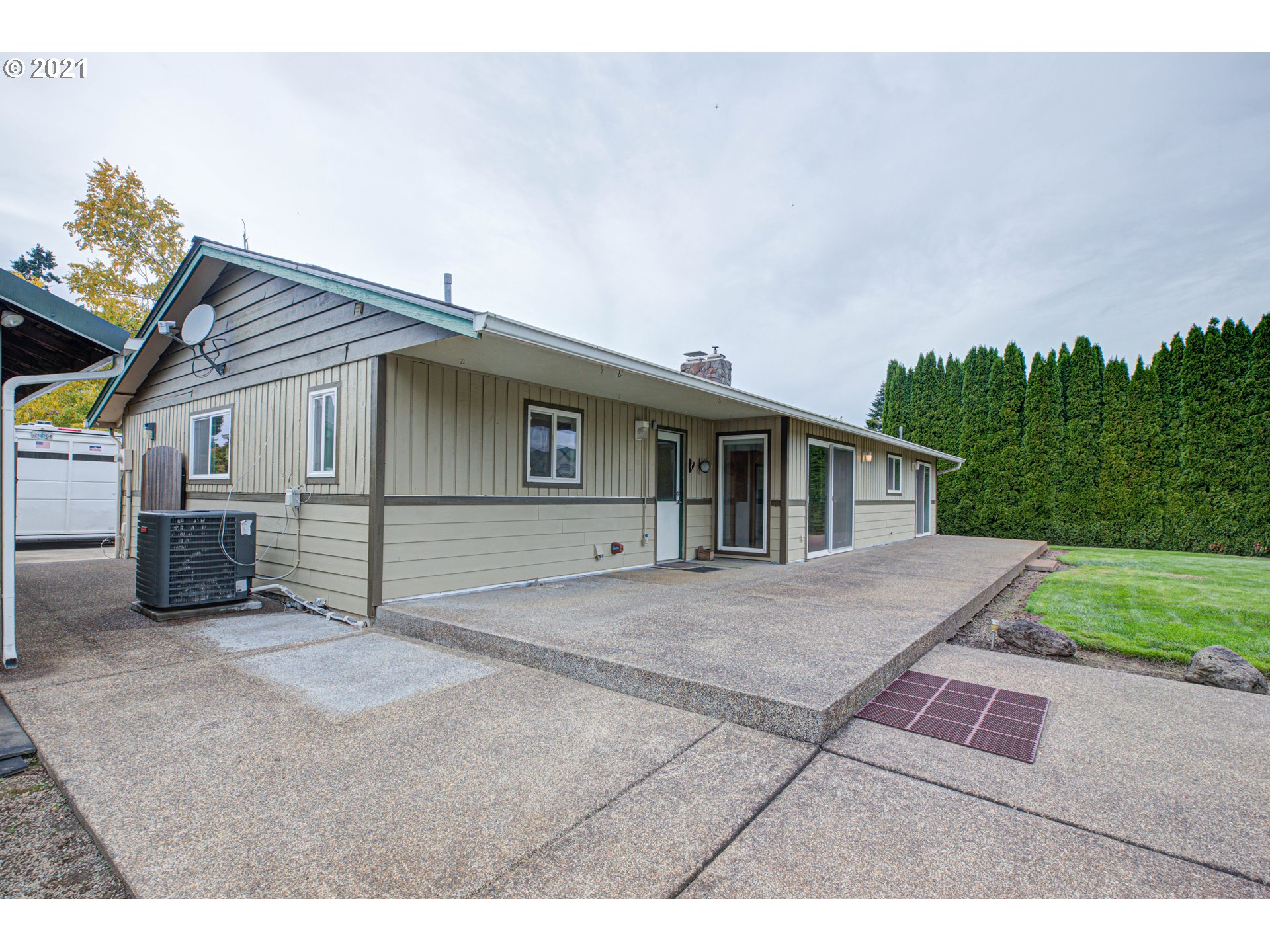 22900 South Haines Road Canby, OR 97013 - Photo 3 of 31 a view of a house with a patio