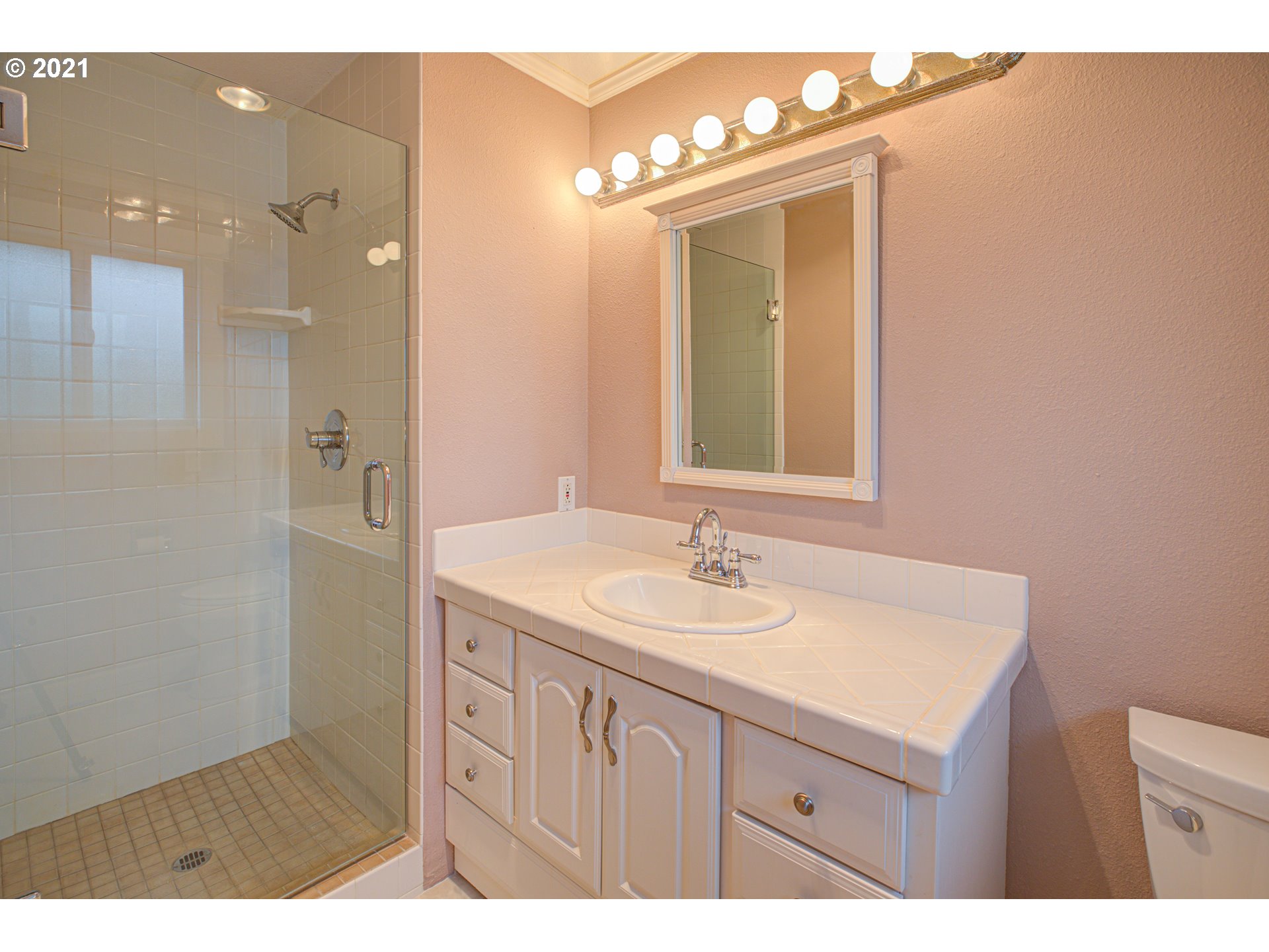 22900 South Haines Road Canby, OR 97013 - Photo 25 of 31 a bathroom with a sink a vanity and a mirror