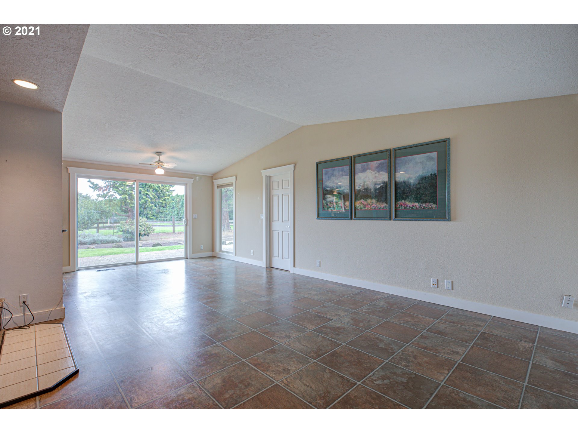 22900 South Haines Road Canby, OR 97013 - Photo 4 of 31 a view of an empty room with wooden floor and a window
