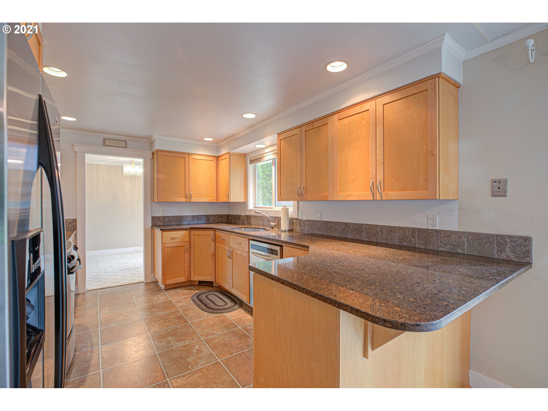 22900 South Haines Road Canby, OR 97013 - Photo 10 of 31 a kitchen with a sink a refrigerator and window