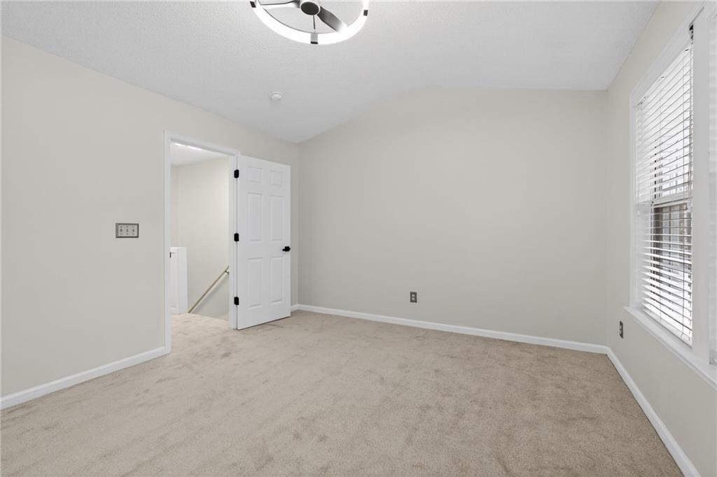 4166 Howell Park Road Duluth, GA 30096 - Photo 11 of 24 a view of an empty room with a window