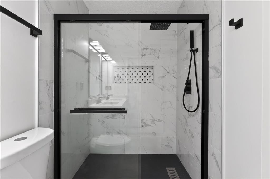 4166 Howell Park Road Duluth, GA 30096 - Photo 14 of 24 a bathroom with a shower