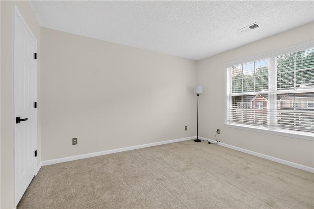 4166 Howell Park Road Duluth, GA 30096 - Photo 15 of 24 a view of an empty room with a window