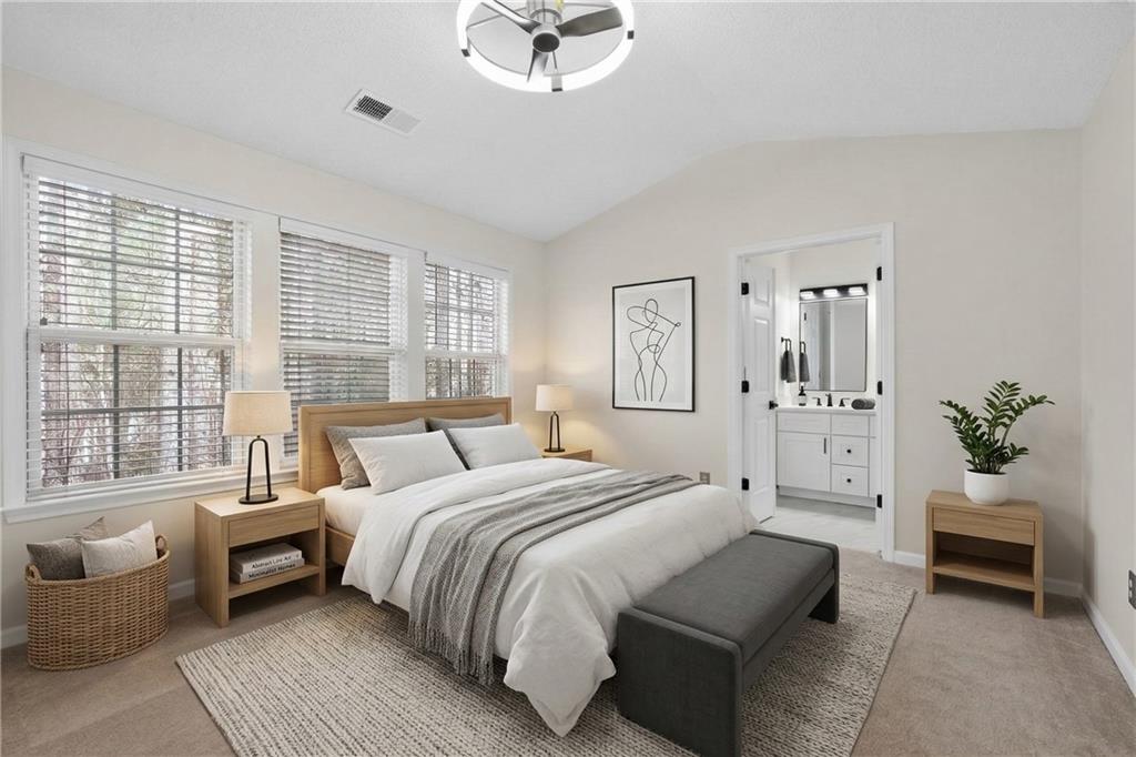 4166 Howell Park Road Duluth, GA 30096 - Photo 20 of 24 a bedroom with a bed couch and a window