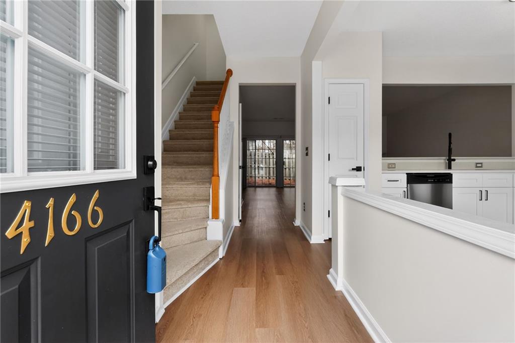 4166 Howell Park Road Duluth, GA 30096 - Photo 2 of 24 a view of a kitchen from a hallway