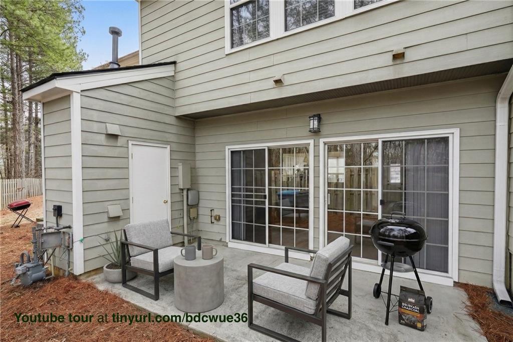 4166 Howell Park Road Duluth, GA 30096 - Photo 23 of 24 a view of a patio with couple of chairs and a table