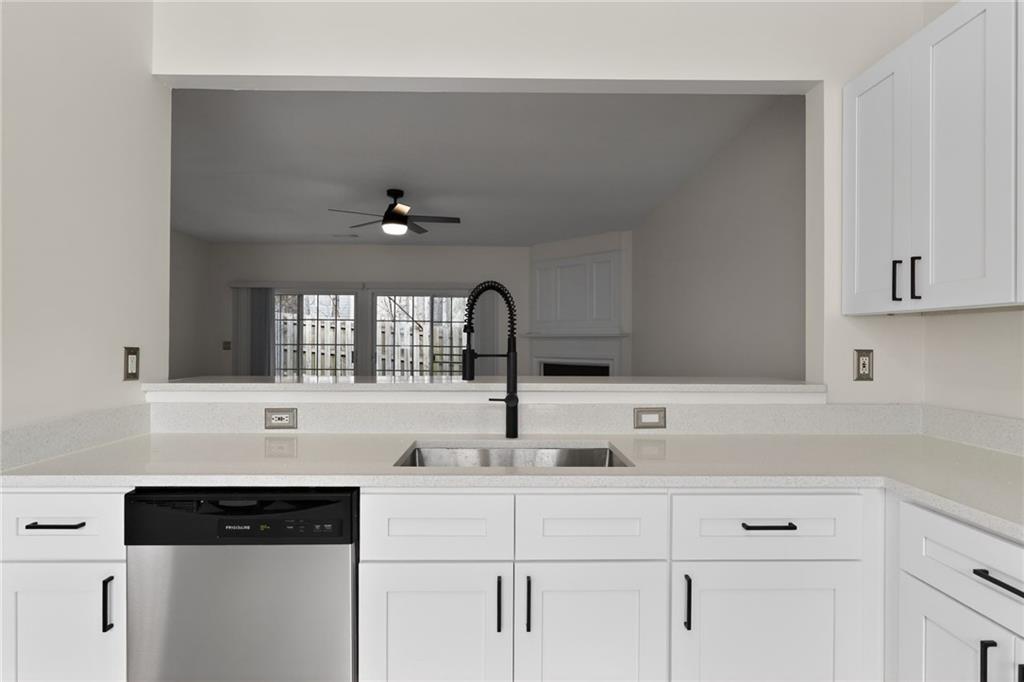 4166 Howell Park Road Duluth, GA 30096 - Photo 9 of 24 a kitchen with a sink and cabinets