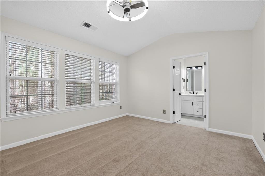 4166 Howell Park Road Duluth, GA 30096 - Photo 10 of 24 a view of an empty room with a window