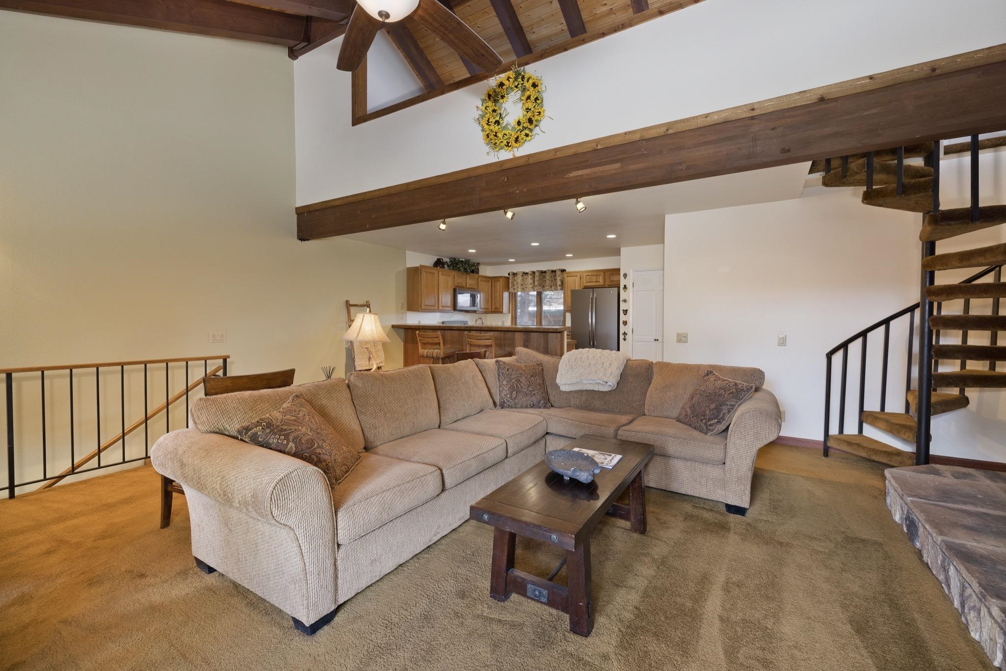 484 Manzanita Road, Unit 16 Mammoth Lakes, CA 93546 - Photo 9 of 34 a living room with furniture and a ceiling fan
