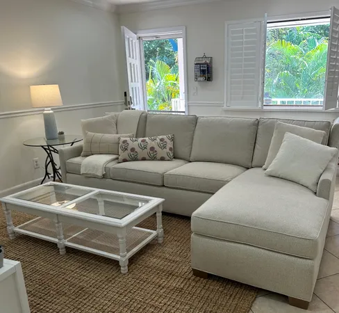 a living room with a couch and a table