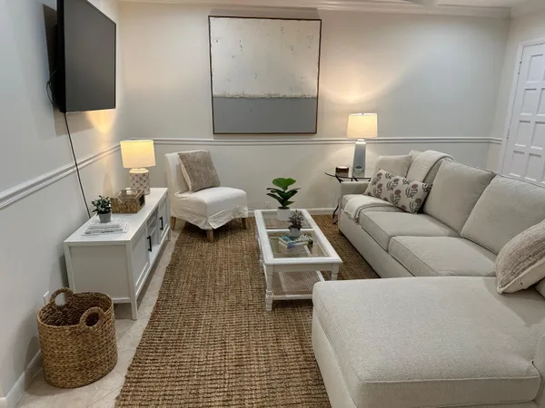 a living room with a couch and a flat screen tv