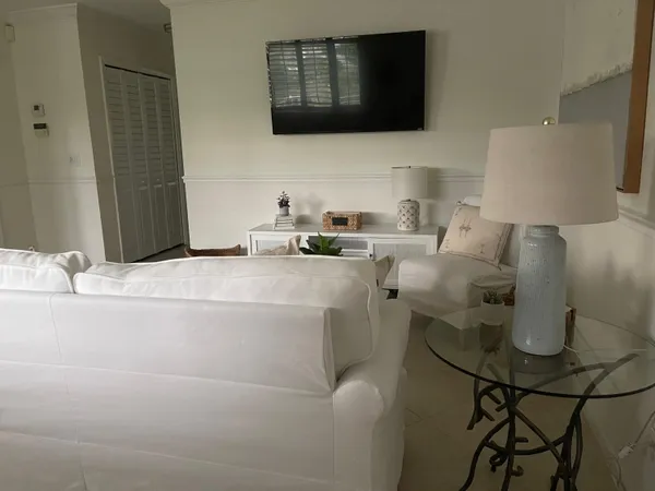 a living room with a couch and a flat screen tv