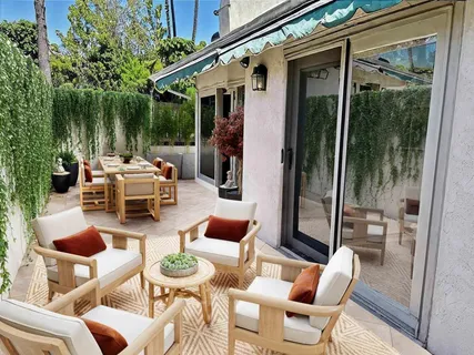 a patio with patio a couch and chairs