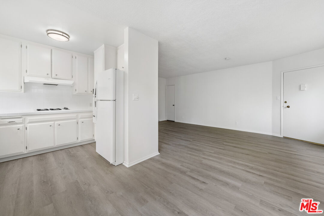 1236 McClellan Drive Los Angeles, CA 90025 - Photo 11 of 13 a view of kitchen with wooden floor