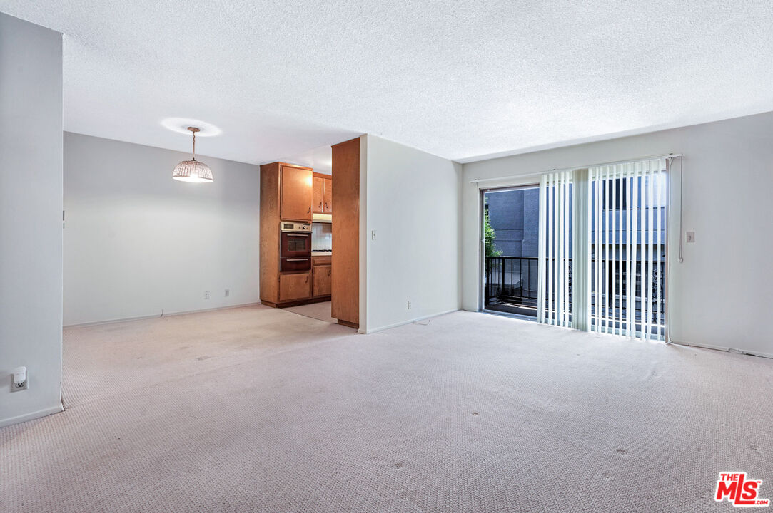 1236 McClellan Drive Los Angeles, CA 90025 - Photo 13 of 13 a view of empty room with floor to ceiling window