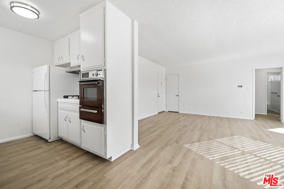 1236 McClellan Drive Los Angeles, CA 90025 - Photo 4 of 13 a view of a kitchen with wooden floor