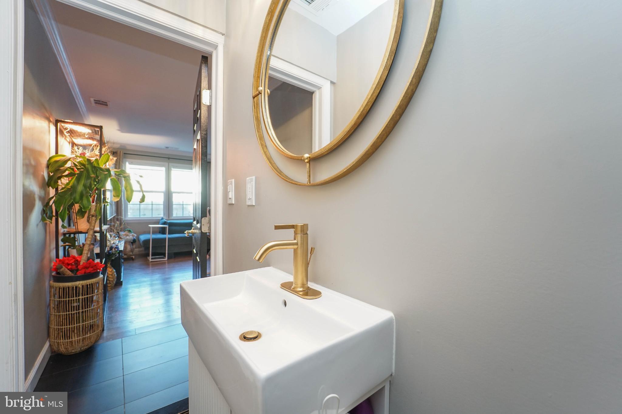 3013 Piano Lane, Unit 34 Silver Spring, MD 20904 - Photo 11 of 40 a bathroom with a sink and a mirror