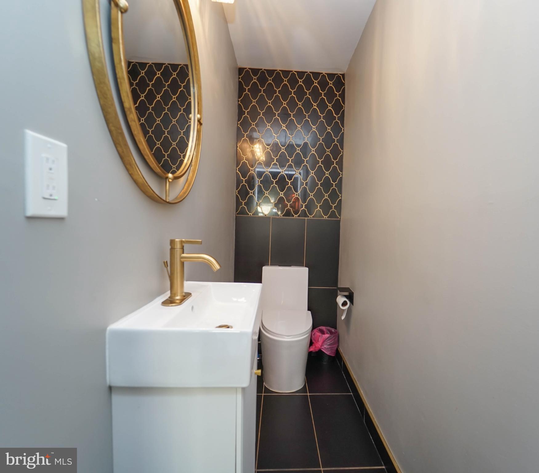 3013 Piano Lane, Unit 34 Silver Spring, MD 20904 - Photo 12 of 40 a bathroom with a toilet and a sink