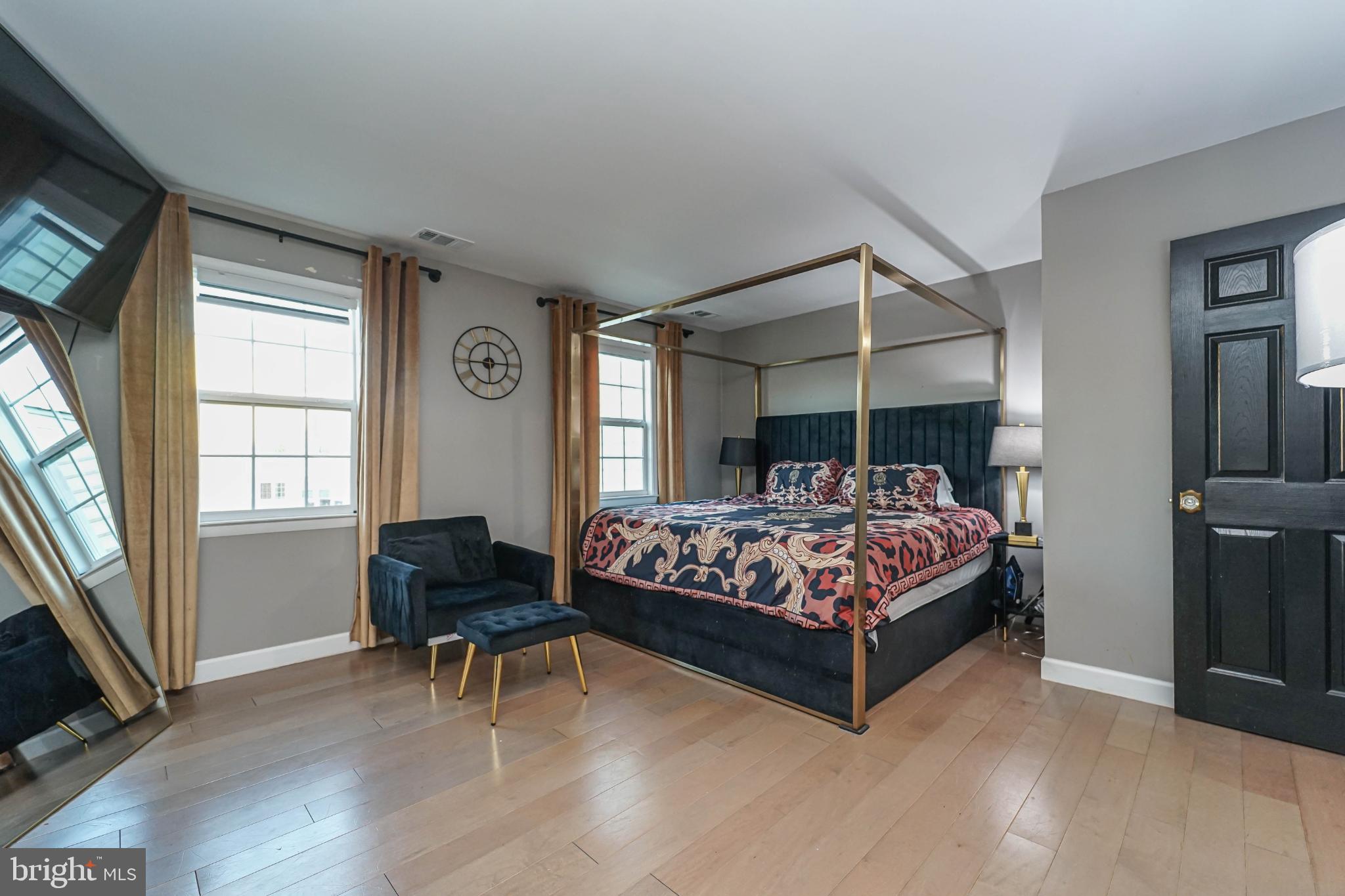 3013 Piano Lane, Unit 34 Silver Spring, MD 20904 - Photo 15 of 40 a bed sitting in a bedroom next to a window
