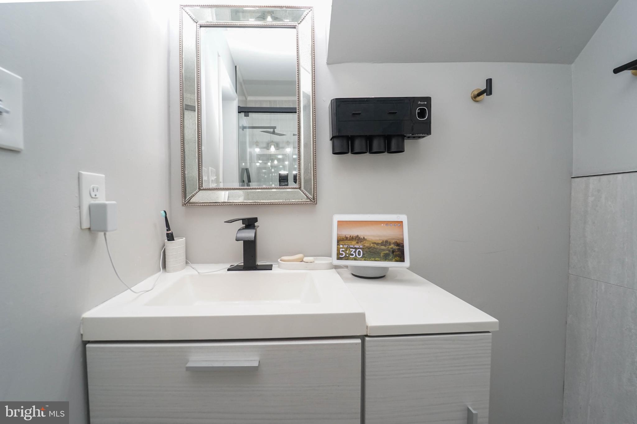 3013 Piano Lane, Unit 34 Silver Spring, MD 20904 - Photo 17 of 40 a bathroom with a sink and a mirror