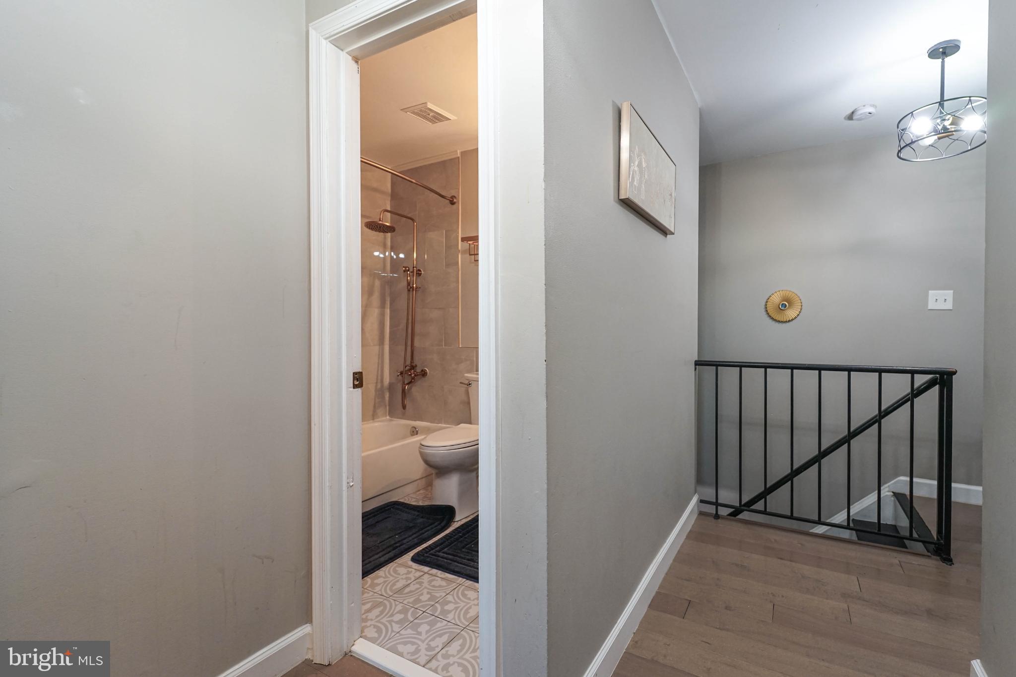 3013 Piano Lane, Unit 34 Silver Spring, MD 20904 - Photo 25 of 40 a bathroom with a granite countertop sink and a toilet