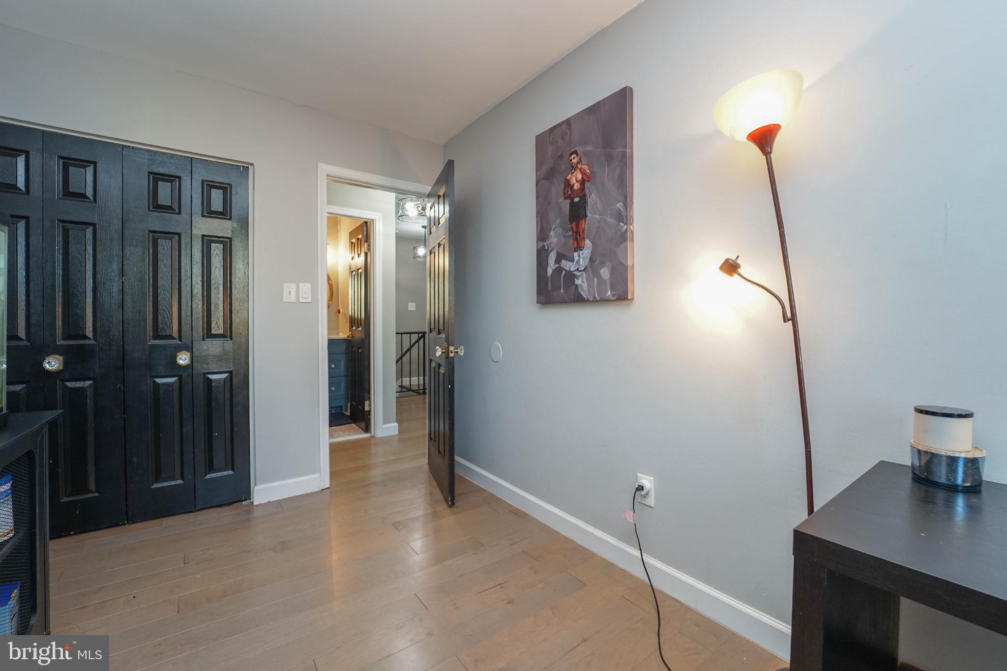 3013 Piano Lane, Unit 34 Silver Spring, MD 20904 - Photo 28 of 40 a view of a hallway with paintings on the wall