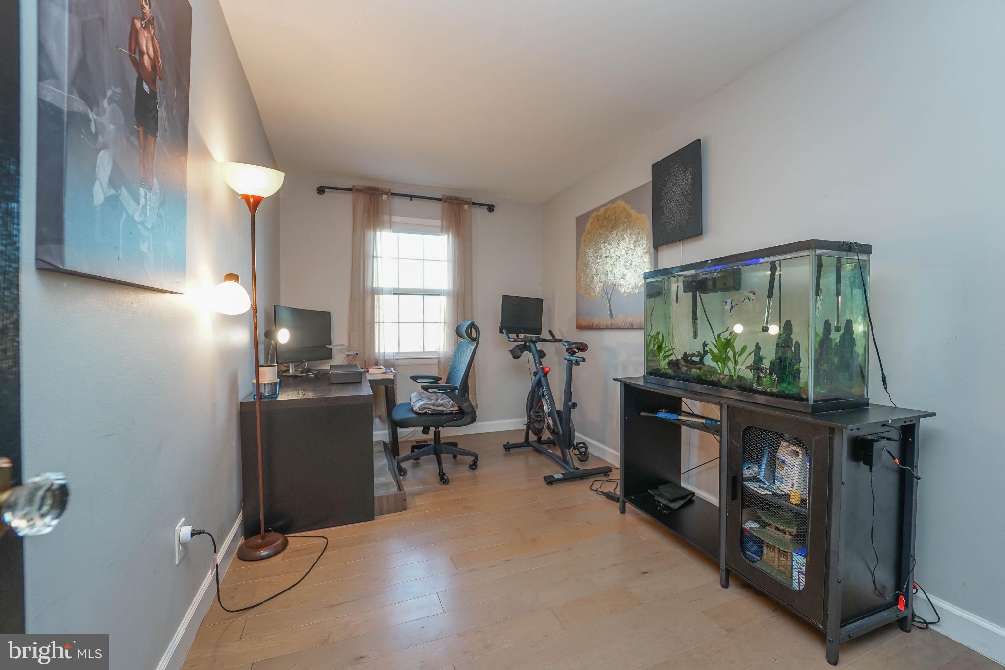 3013 Piano Lane, Unit 34 Silver Spring, MD 20904 - Photo 29 of 40 a room with furniture a window and a flat screen tv