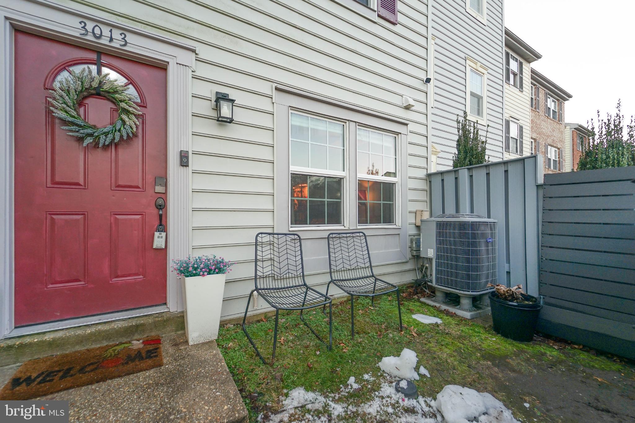 3013 Piano Lane, Unit 34 Silver Spring, MD 20904 - Photo 32 of 40 a front view of a house with garden