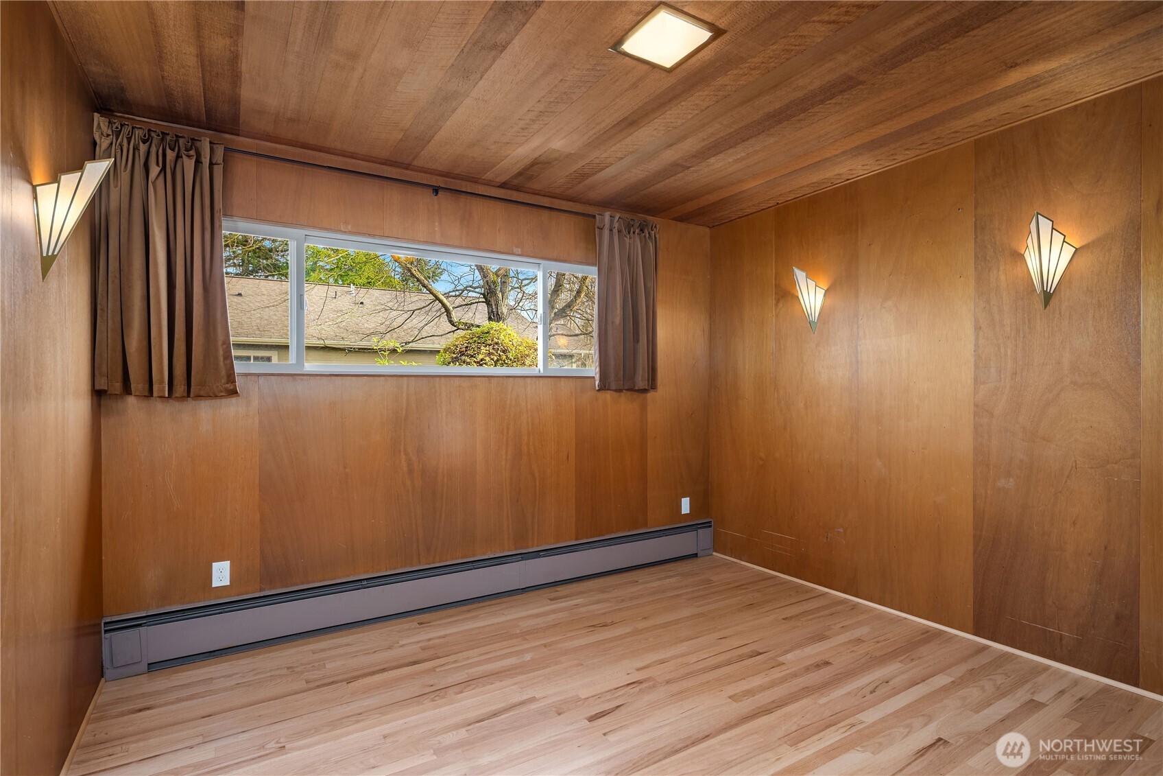 452 11th Street Blaine, WA 98230 - Photo 19 of 33 an empty room with wooden floor and windows