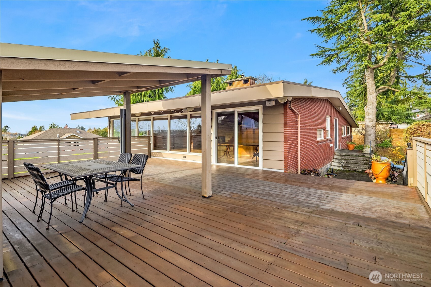 452 11th Street Blaine, WA 98230 - Photo 2 of 33 a view of a house with wooden deck and furniture