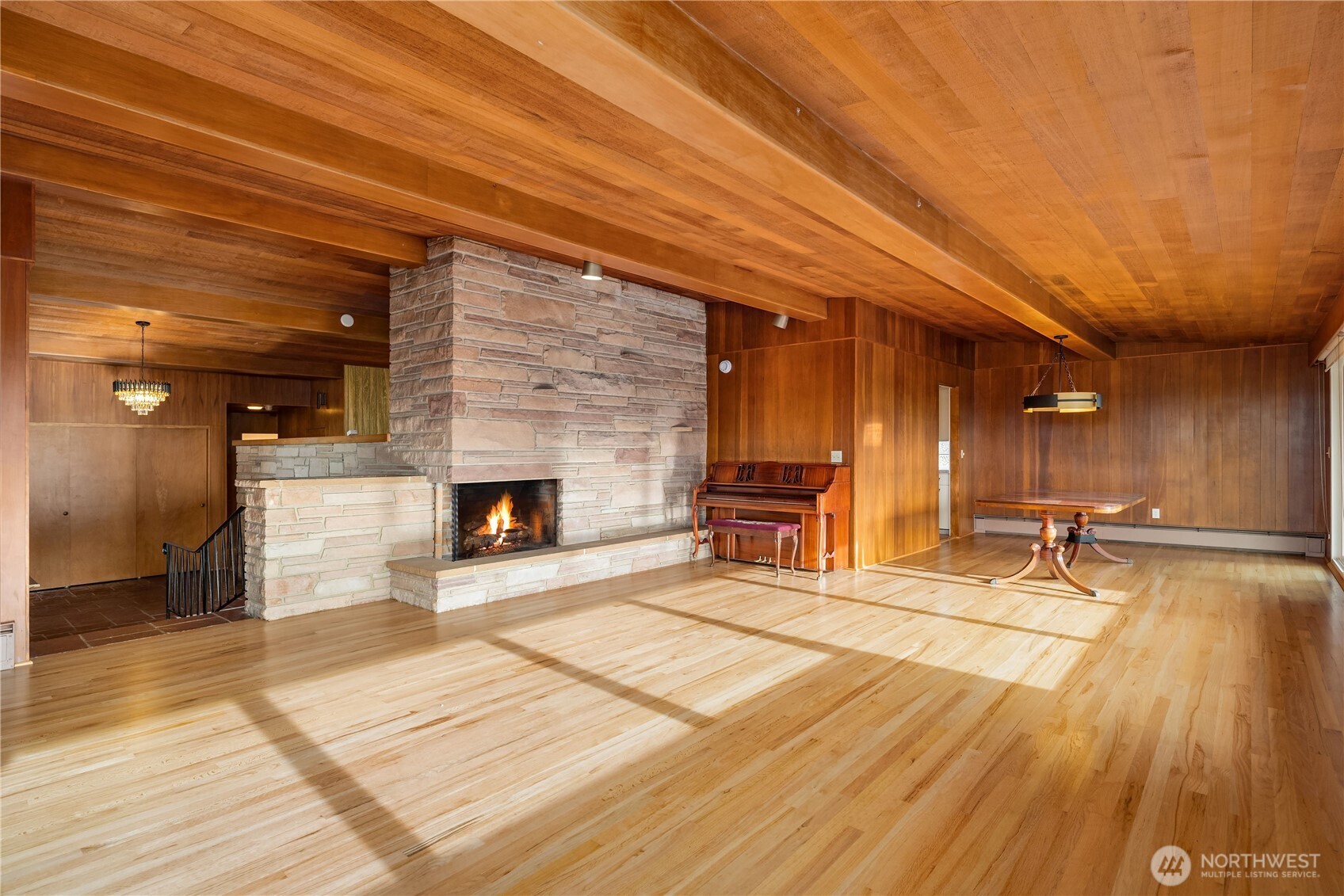 452 11th Street Blaine, WA 98230 - Photo 6 of 33 a view of a hall with wooden floor and a fireplace