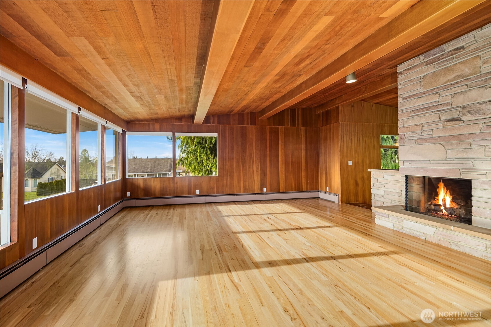 452 11th Street Blaine, WA 98230 - Photo 7 of 33 a view of an empty room with a fireplace and a window