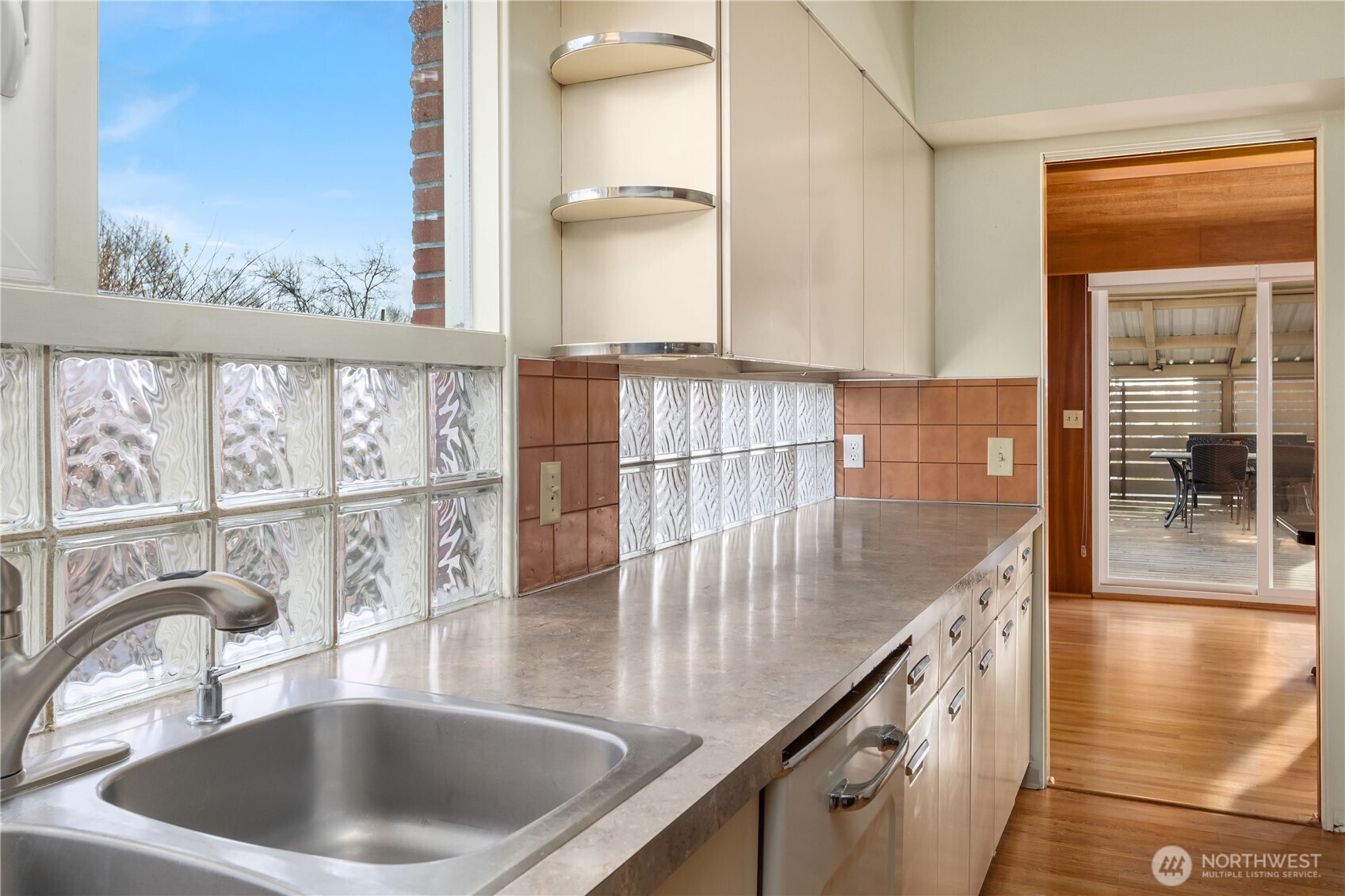 452 11th Street Blaine, WA 98230 - Photo 9 of 33 a kitchen with kitchen island a large window a sink and a counter top space