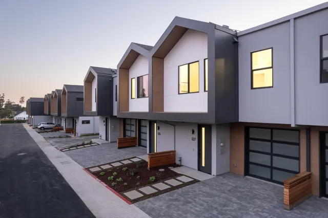 a front view of a house with parking