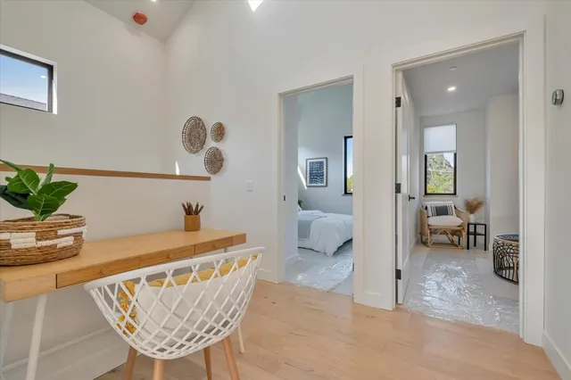 a dining room with furniture and a chandelier