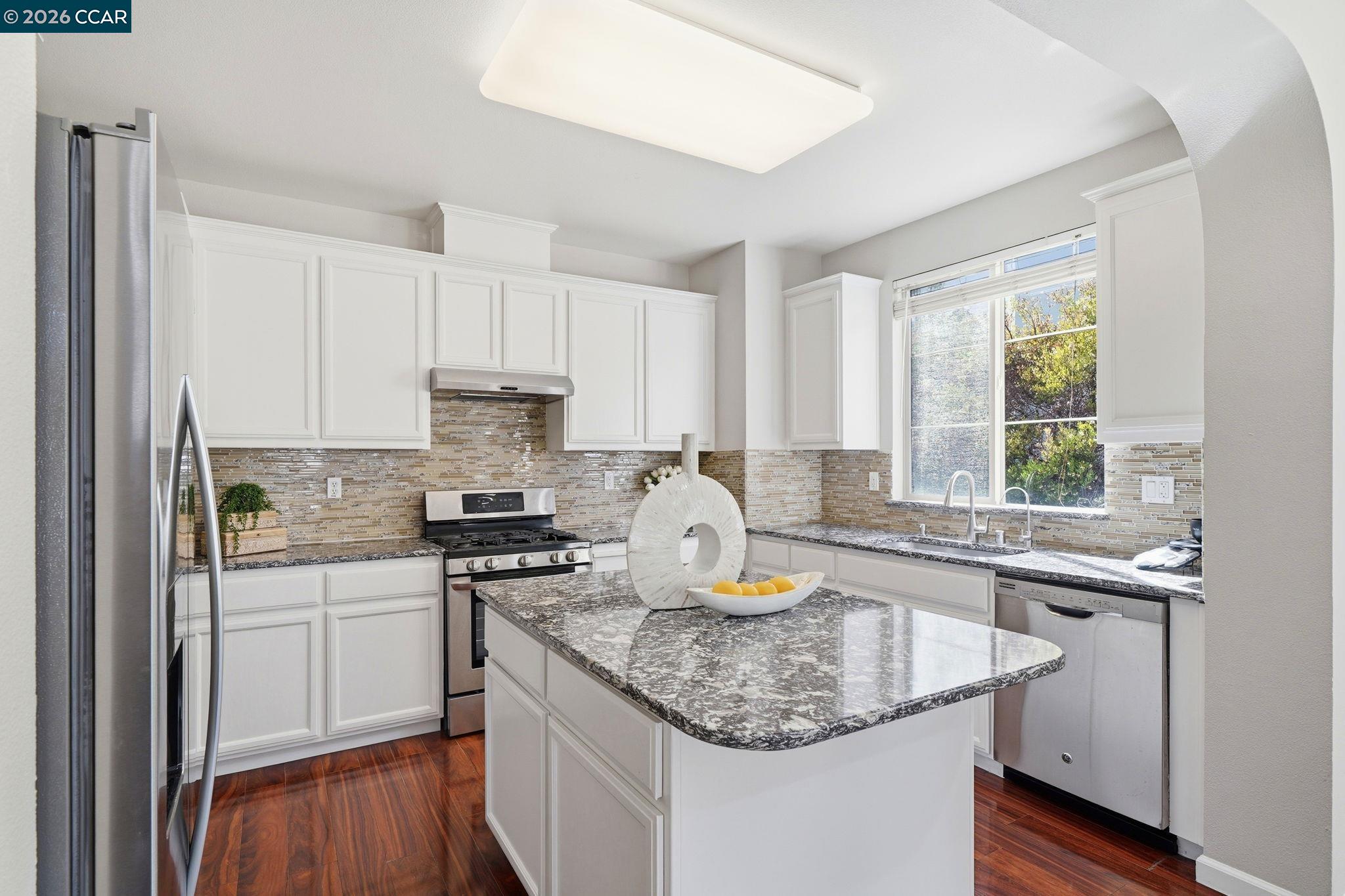 3217 Amaryllis Circle San Ramon, CA 94582 - Photo 13 of 48 a kitchen with stainless steel appliances granite countertop a sink stove and refrigerator